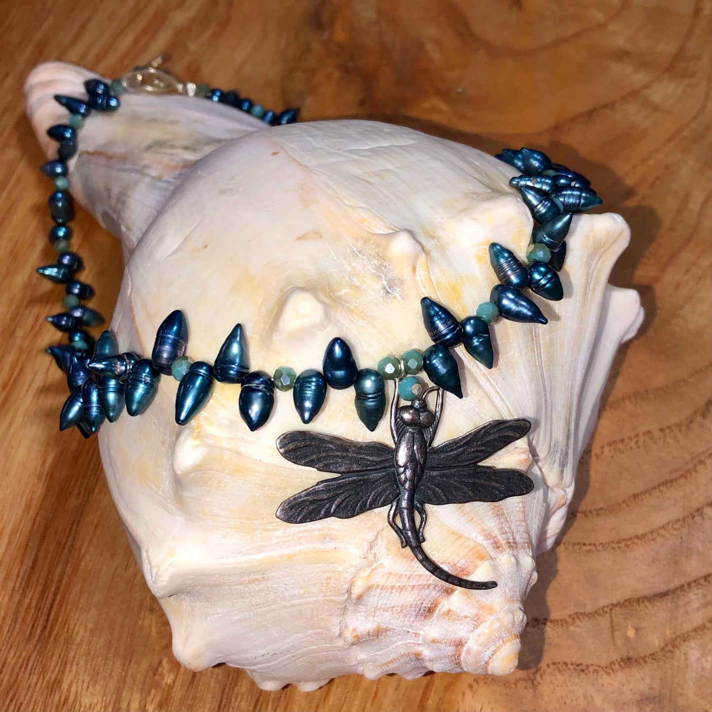 Sterling silver dragonfly pendant necklace with blue teardrop pearls, and blue glass beads.