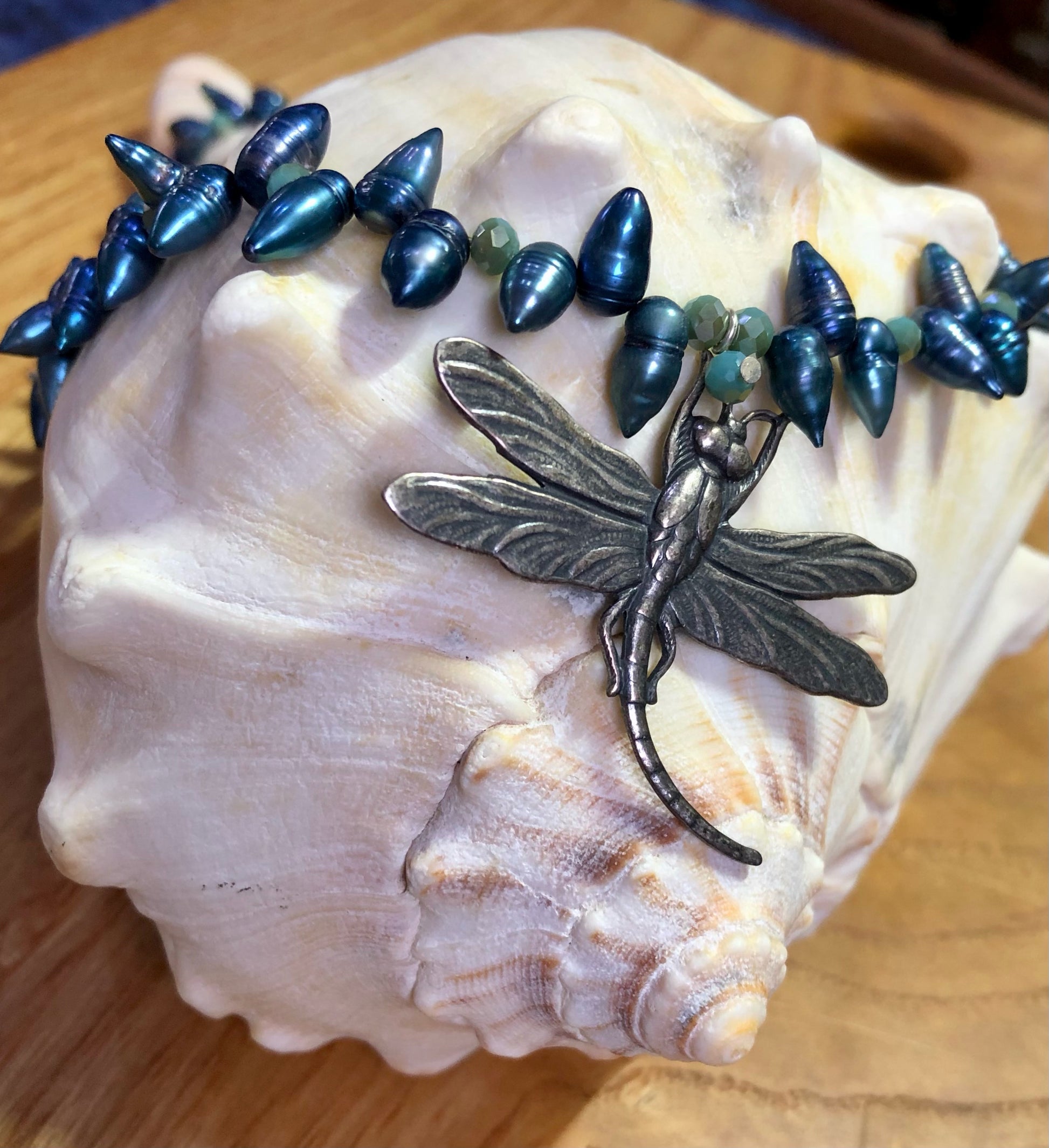 Sterling silver dragonfly pendant necklace with  blue teardrop pearls, and blue glass beads.