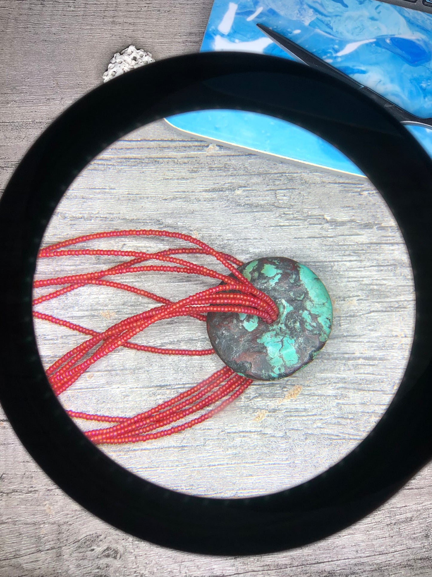 Turquoise Donut Pendant Strung on 8 Strands of Red Glass Seed Beads