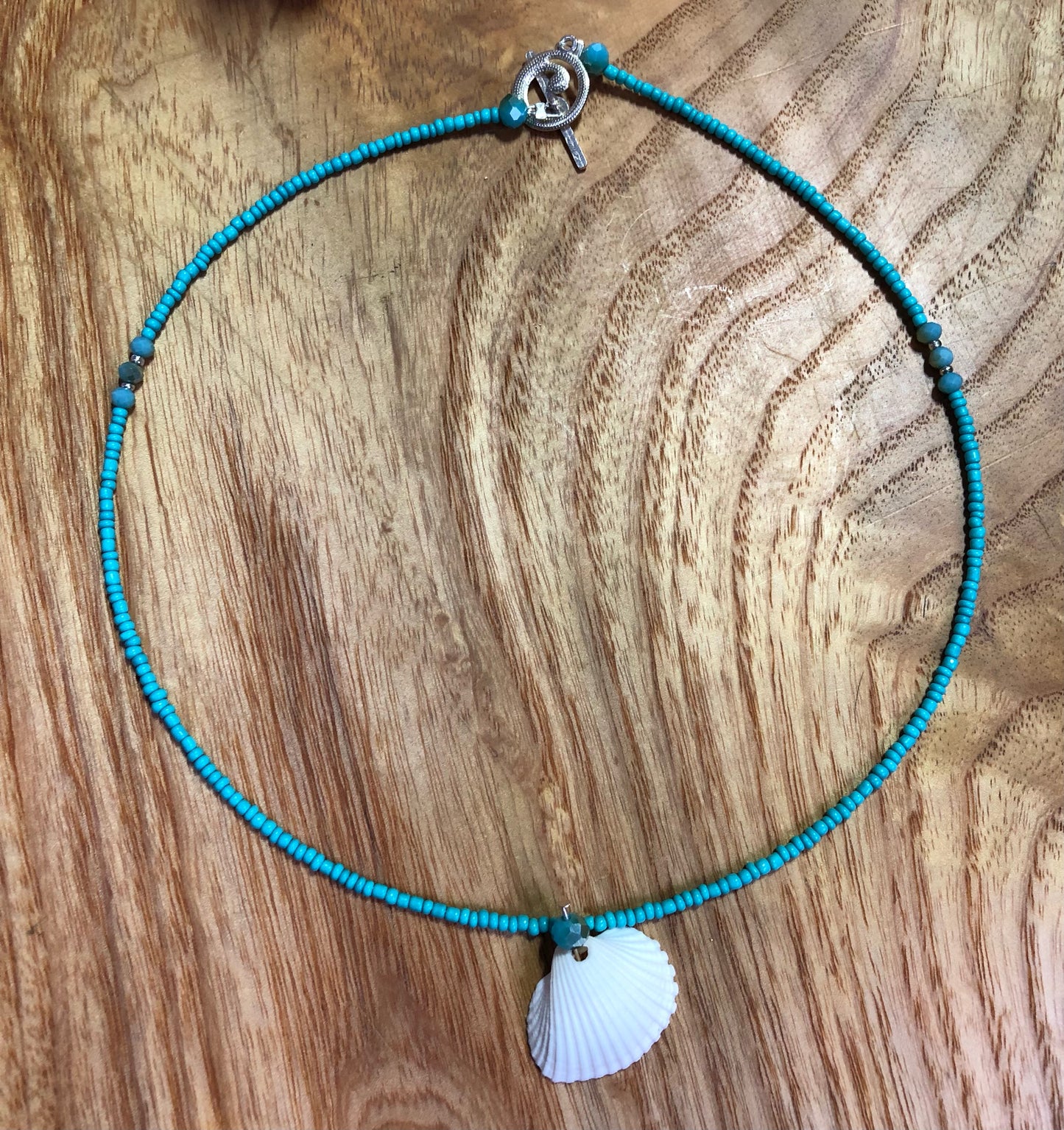 White seashell necklace with turquoise glass beads, and glass seed beads.