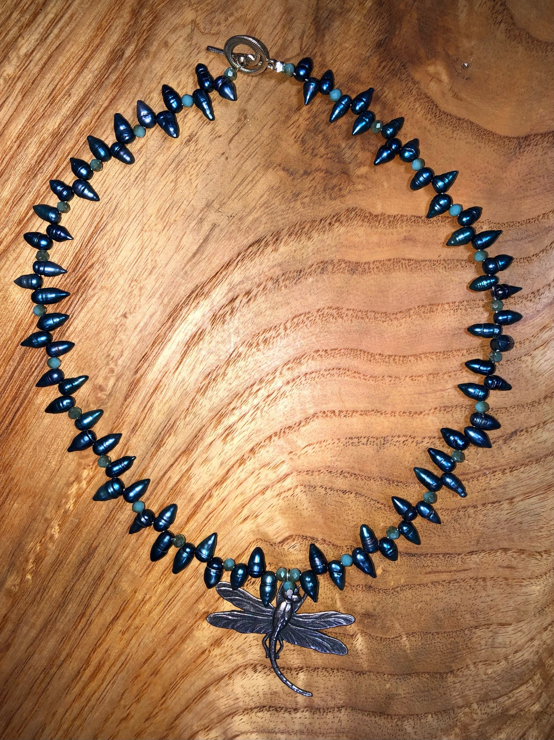 Sterling silver dragonfly pendant necklace with  blue teardrop pearls, and blue glass beads.