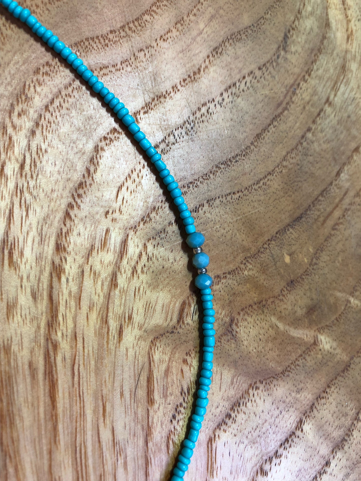 White seashell necklace with turquoise glass beads, and glass seed beads.