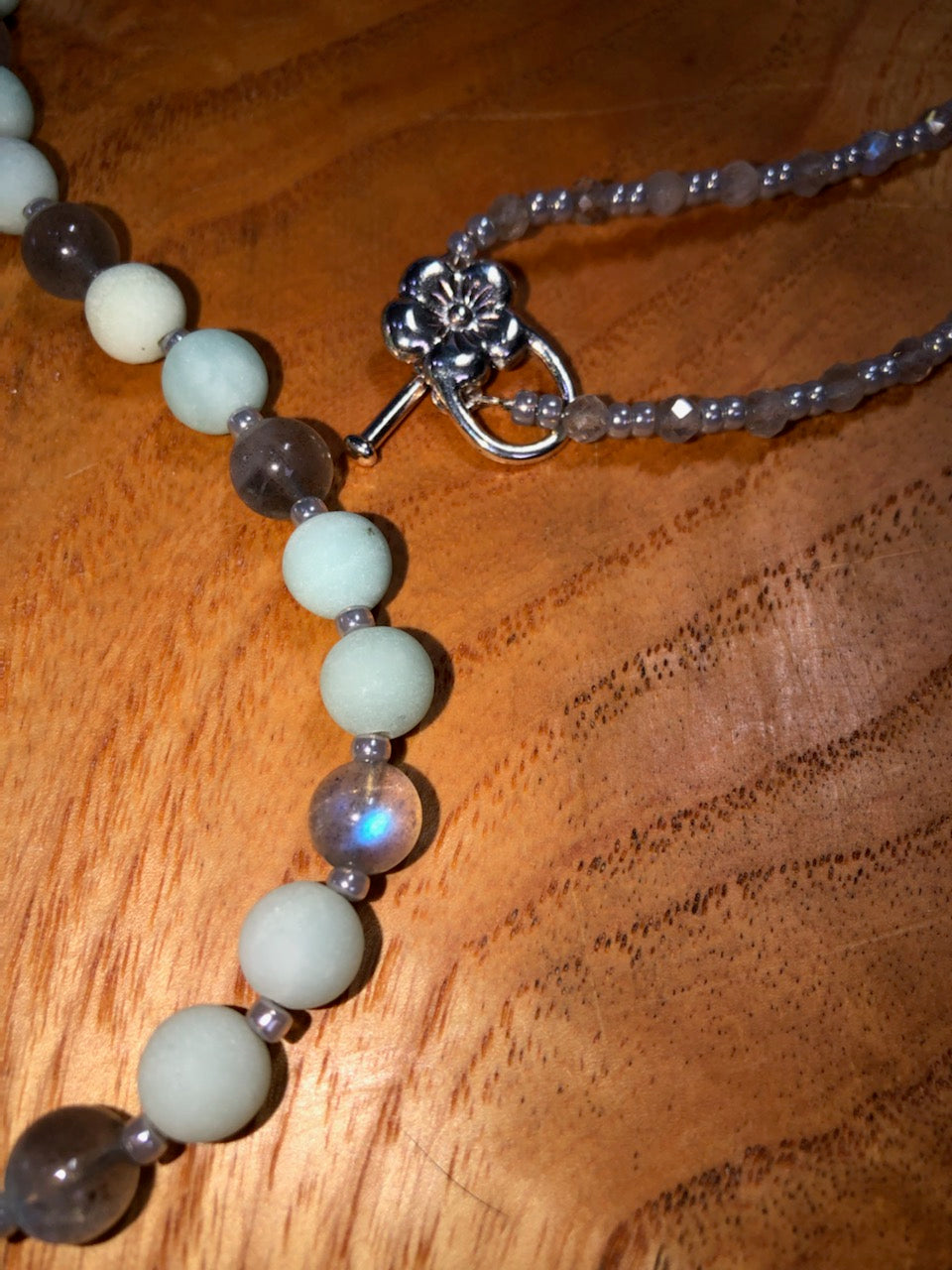 Mala with matte blue aventurine beads, labradorite beads, ceylon glass seed beads, silver plated clasp, and ceylon tassel.